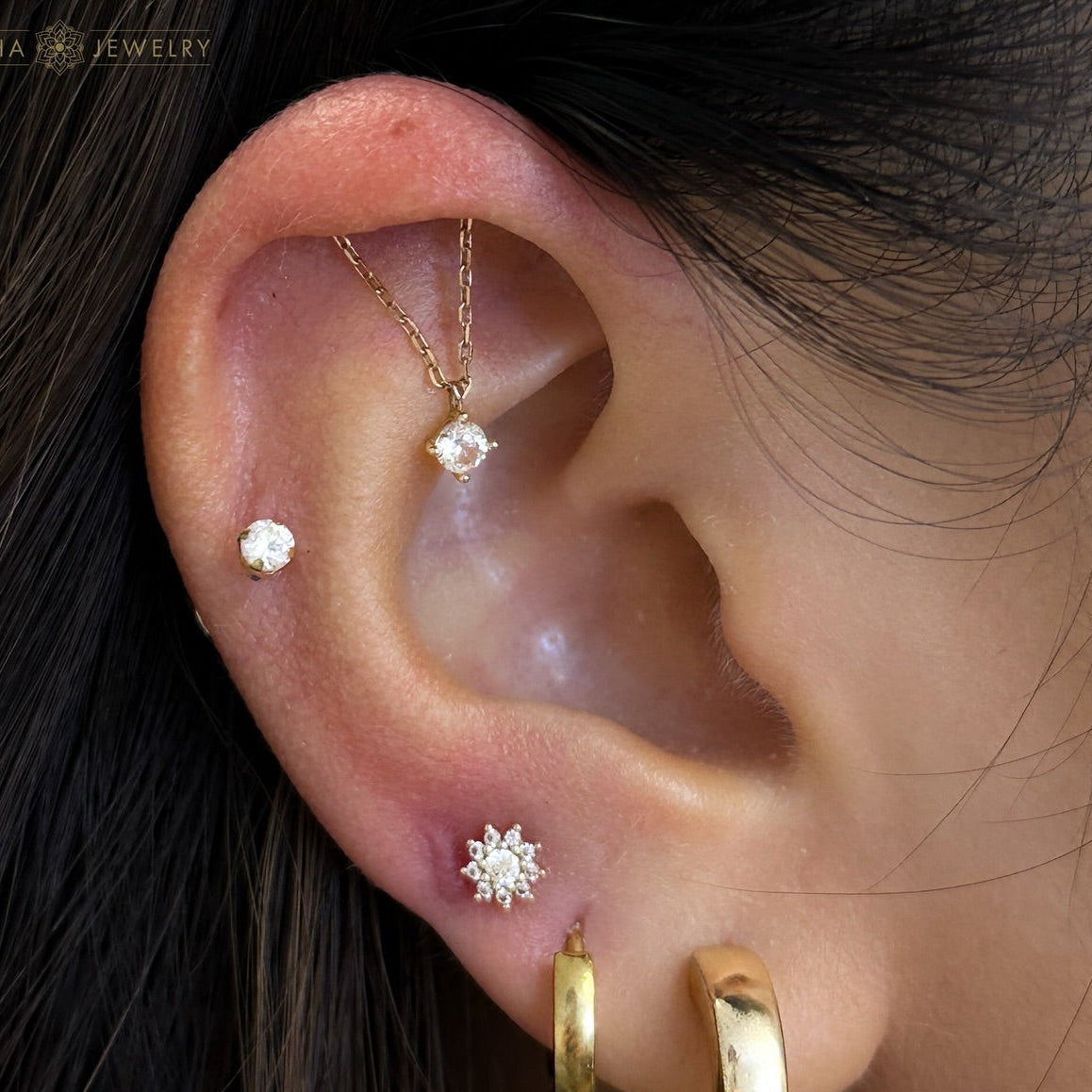 Multi piercing ear curation in 14K gold at Piercing Lab Calgary